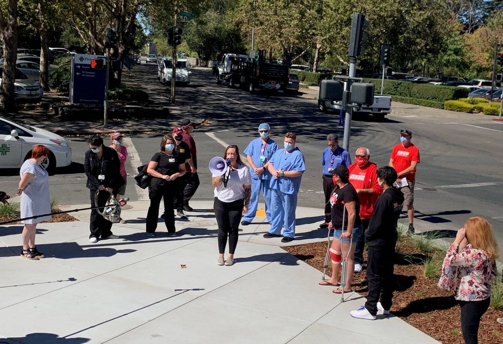 Workers at Memorial Hospital in Santa Rosa rally against the hospital