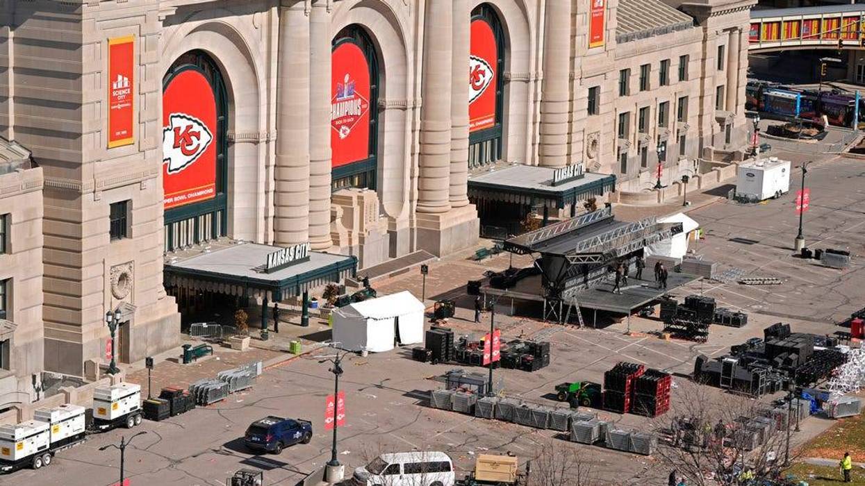 Workers dismantle the stage outside of Union Station