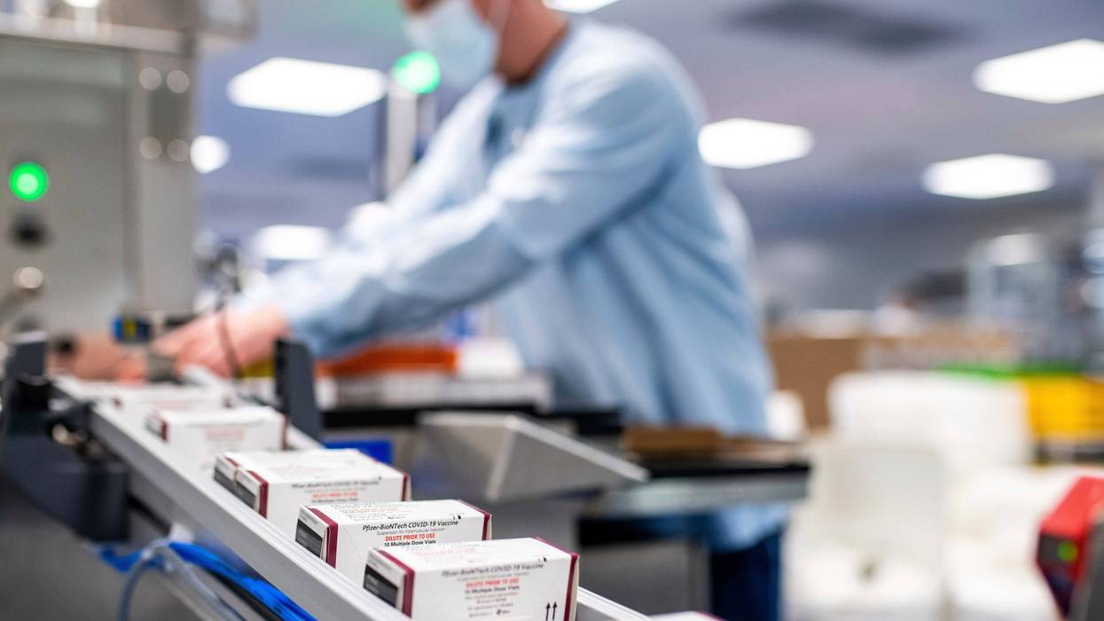 Workers on the production line for Pfizer's COVID-19 vaccine for children under 5 in Puurs, Belgium. U.S. regulators on Friday, June 17, authorized the first COVID-19 shots for infants and preschoolers, paving the way for vaccinations to begin next week.