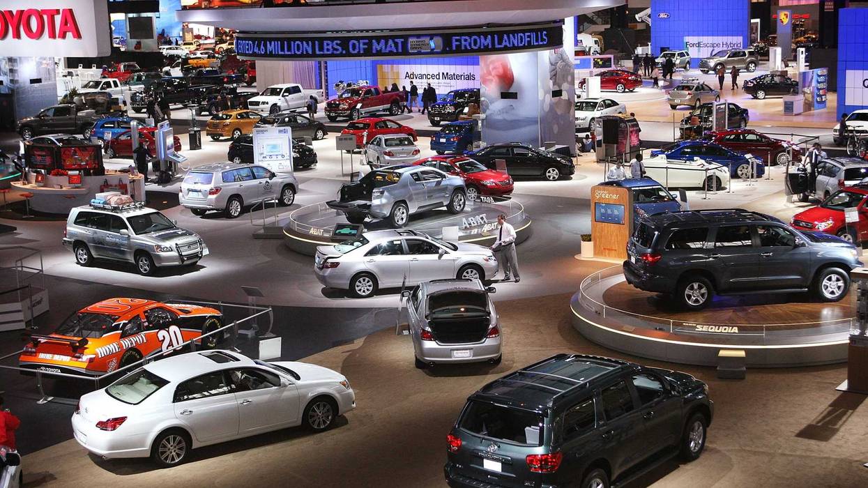 Workers prepare displays for the opening of the Chicago Auto Show February 7, 2008 in Chicago, Illinois.