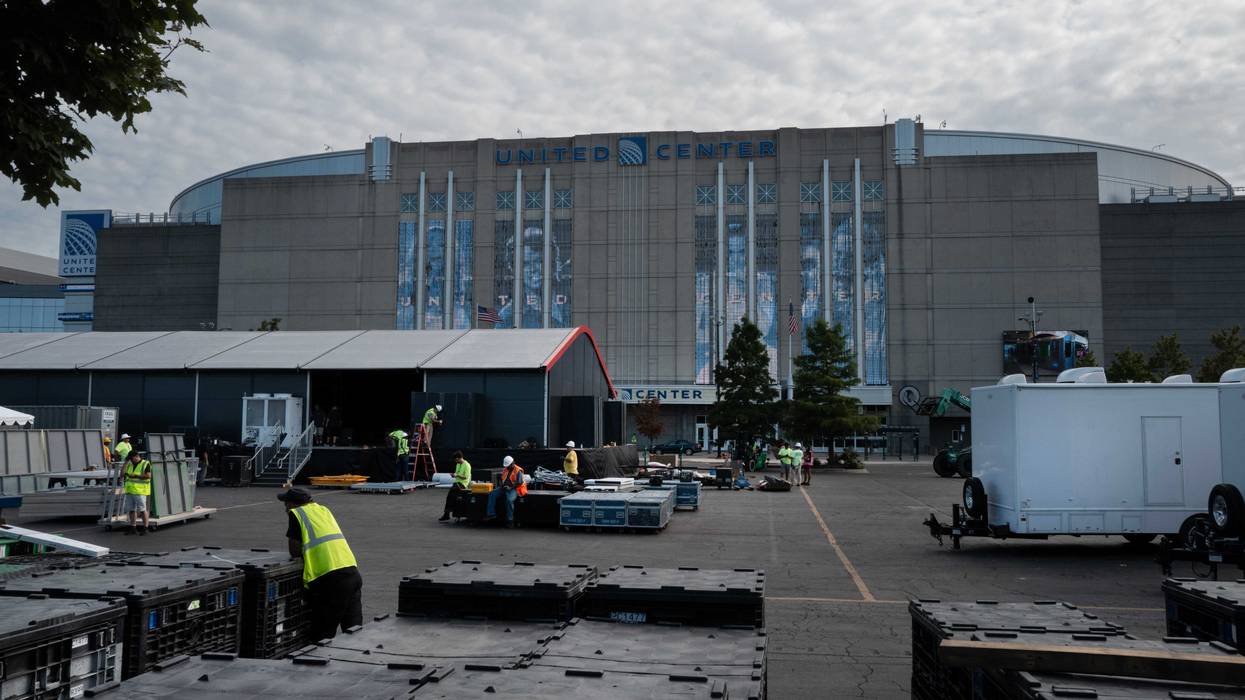 Workers prepare the United Center