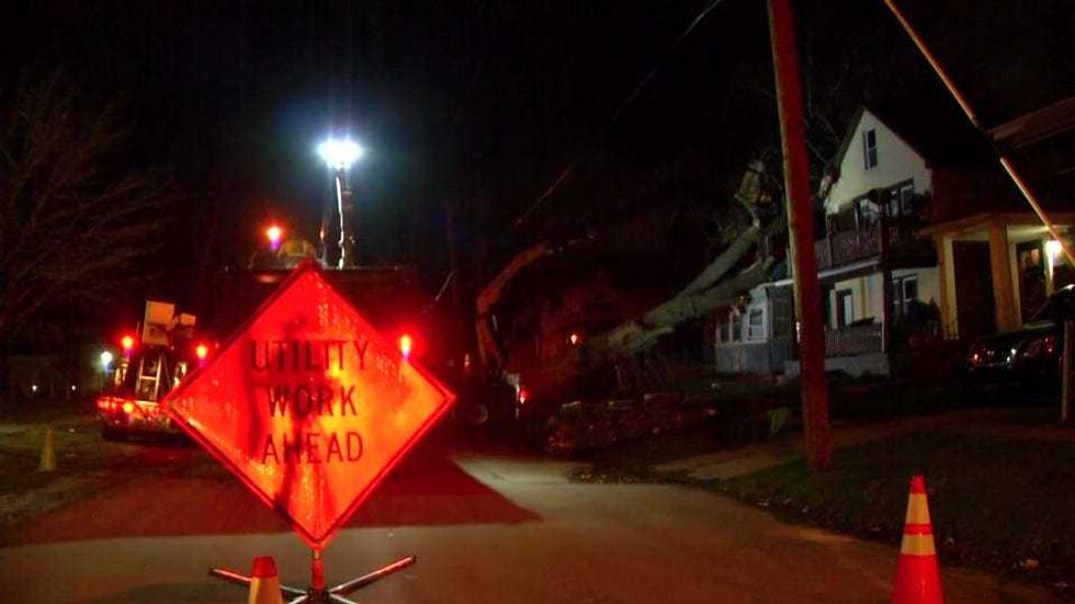 Workers remove doenwed trees in Buffalo