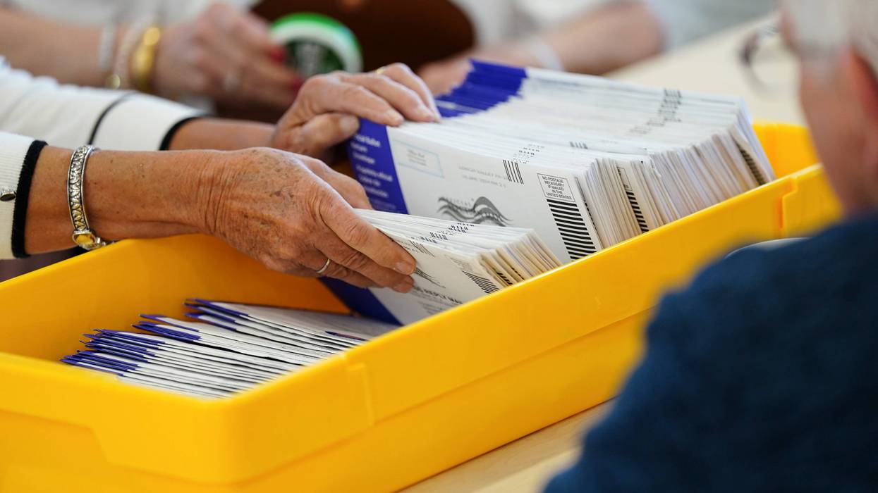 Workers sort mail ballots on primary Election Day 2024 at Northampton County Courthouse in Easton, Pennsylvania.