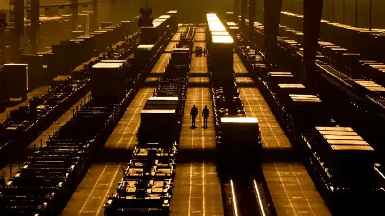 Workers walk at BNSF intermodal terminal