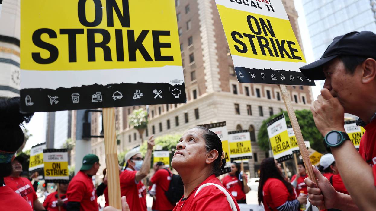 workers with picket signs