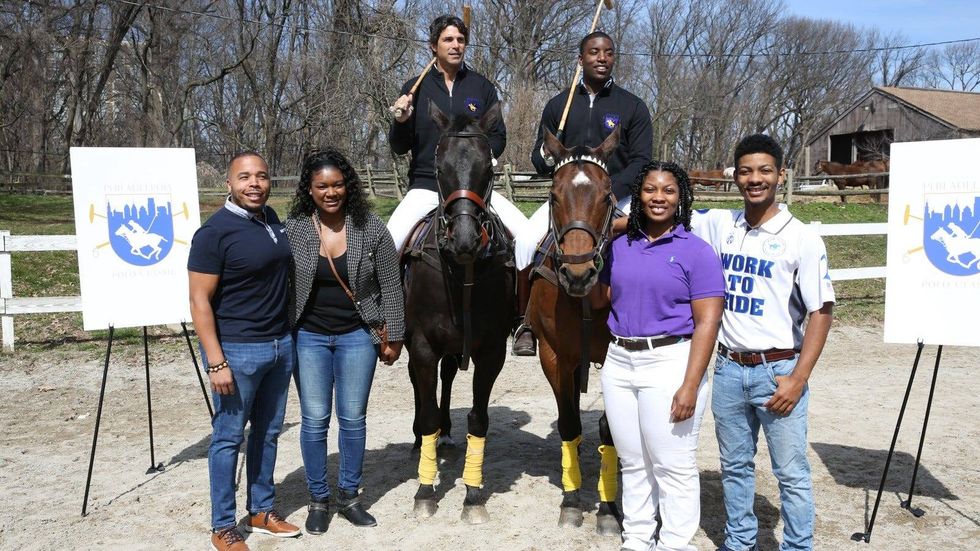 World-famous champion polo player Nacho Figueras and Work to Ride alumnus Kareem Rosser on horseback, along with other members of Work to Ride at Chamounix Equestrian Center in Philadelphia.