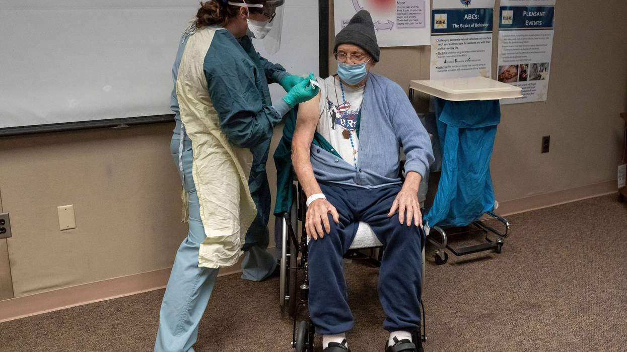 World War II Army veteran John Stephens, 96, receives a COVID-19 vaccine at a Veterans Affairs long-term care facility on December 17, 2020 in Vancouver, Washington. Patients in long-term care facilities began receiving the Pfizer-BioNTech COVID-19 vaccine in Oregon in December.