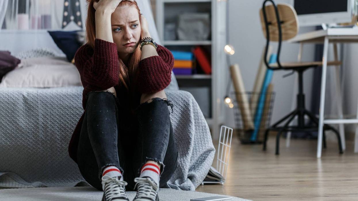 Worried girl holding head
