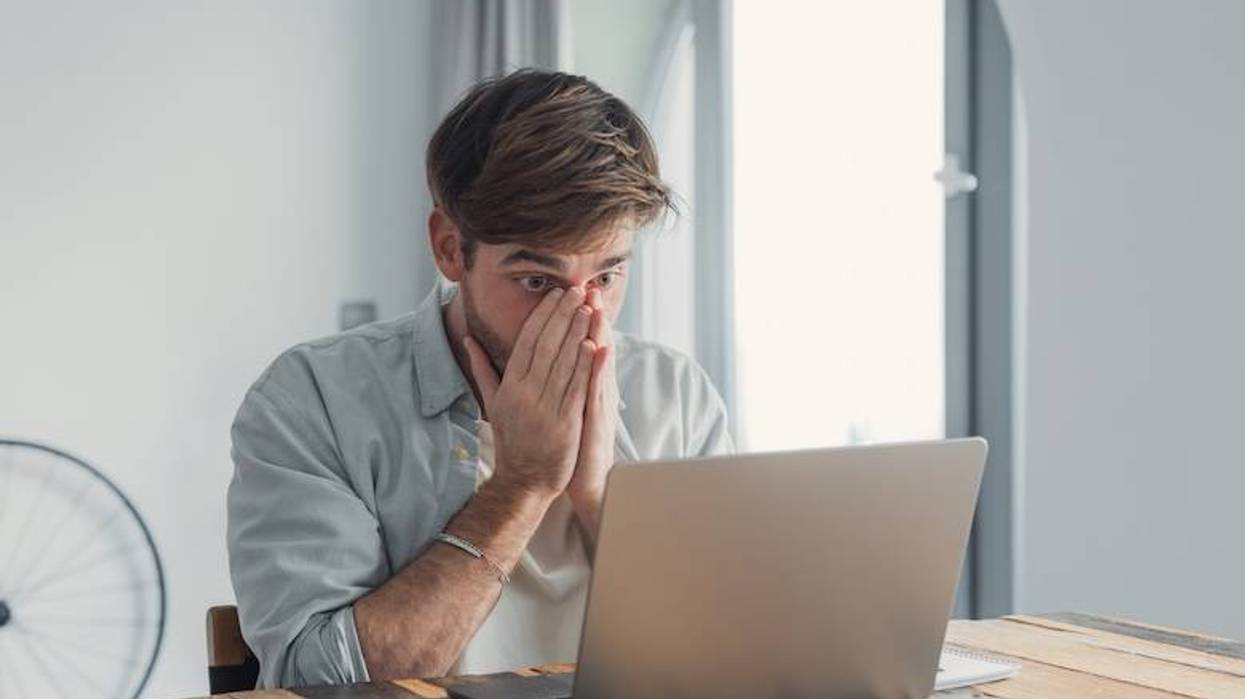 Worried man looking at computer