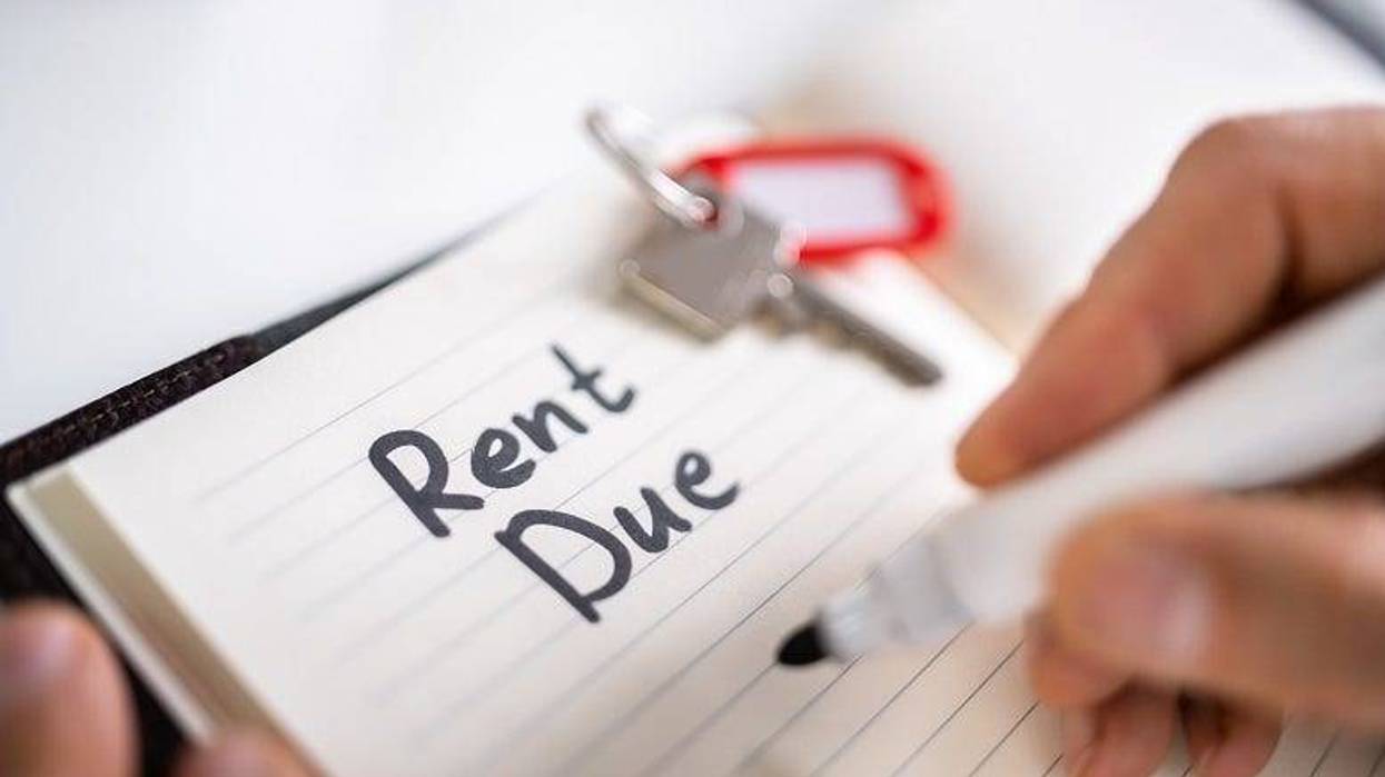 writing "rent due" on notepad
