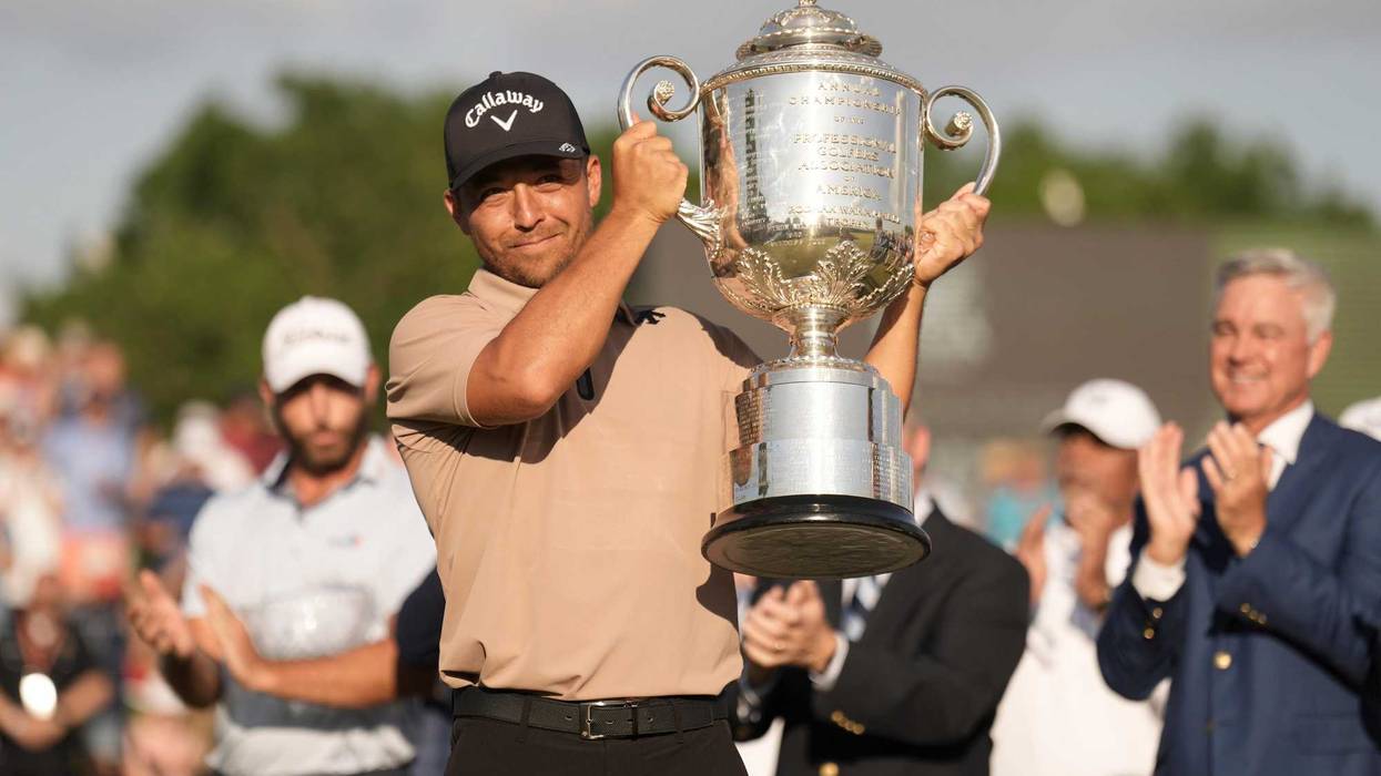 Xander Schauffele holds up the Wanamaker Trophy after winning the 2024 PGA Championship at Valhalla Golf Club May 19, 2024