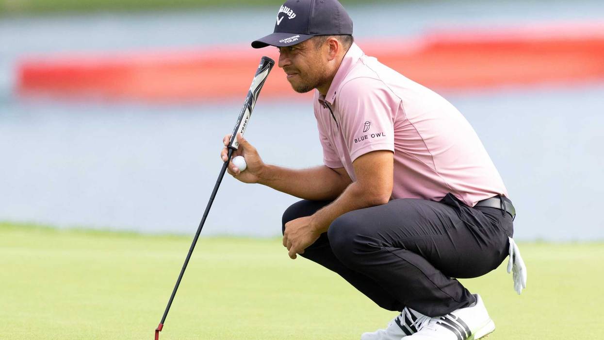 Xander Schauffele prepares to putt on the 17th hole during the first round of the Travelers Championship golf tournament.