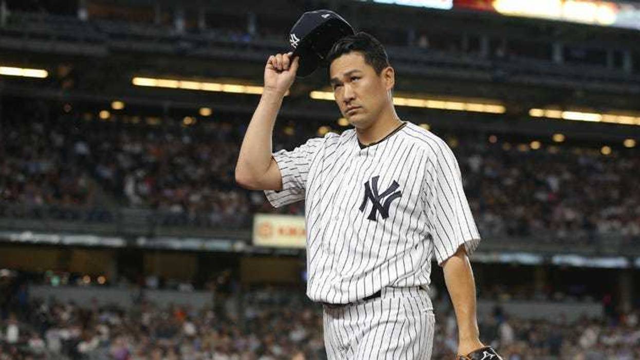 Yankees pitcher Masahiro Tanaka smiles after pitching a complete-game 3-hitter against the Tampa Bay Rays on July 24, 2018, at Tropicana Field in St. Petersburg, Florida.