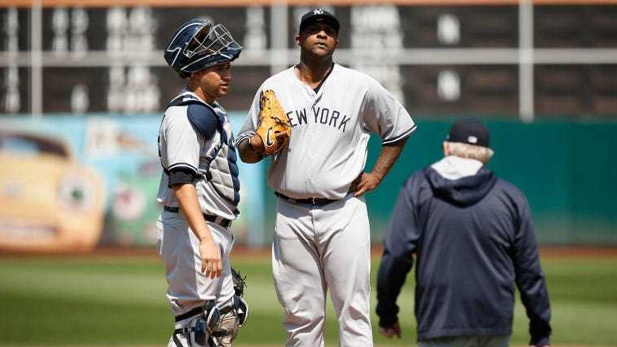 Yankees pitching coach Larry Rothschild approaches the mound to talking to CC Sabathia on Sept. 3, 2018, at Oakland Coliseum in Oakland, California.