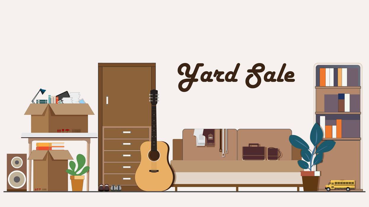 Yard sale scene with various secondhand items.