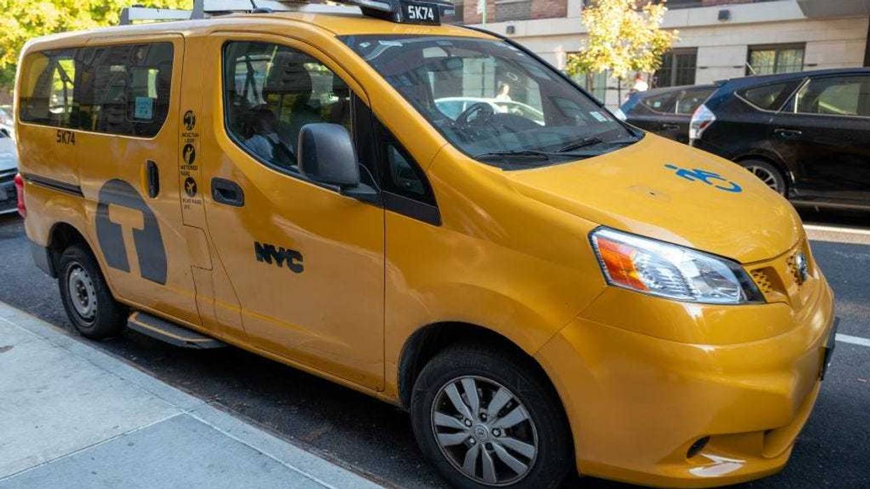 Yellow NYC taxi parked on a residential street on a sunny day, Oct. 22, 2024.