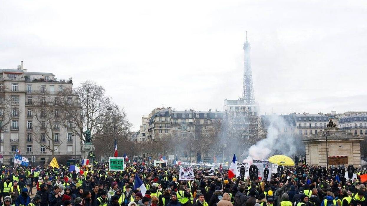 Yellow vest protesters march Saturday, Jan. 19, 2019 in Paris.