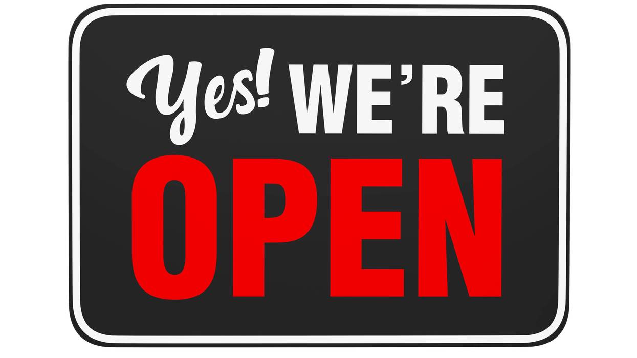 "Yes We're Open" Sign isolated on white background
