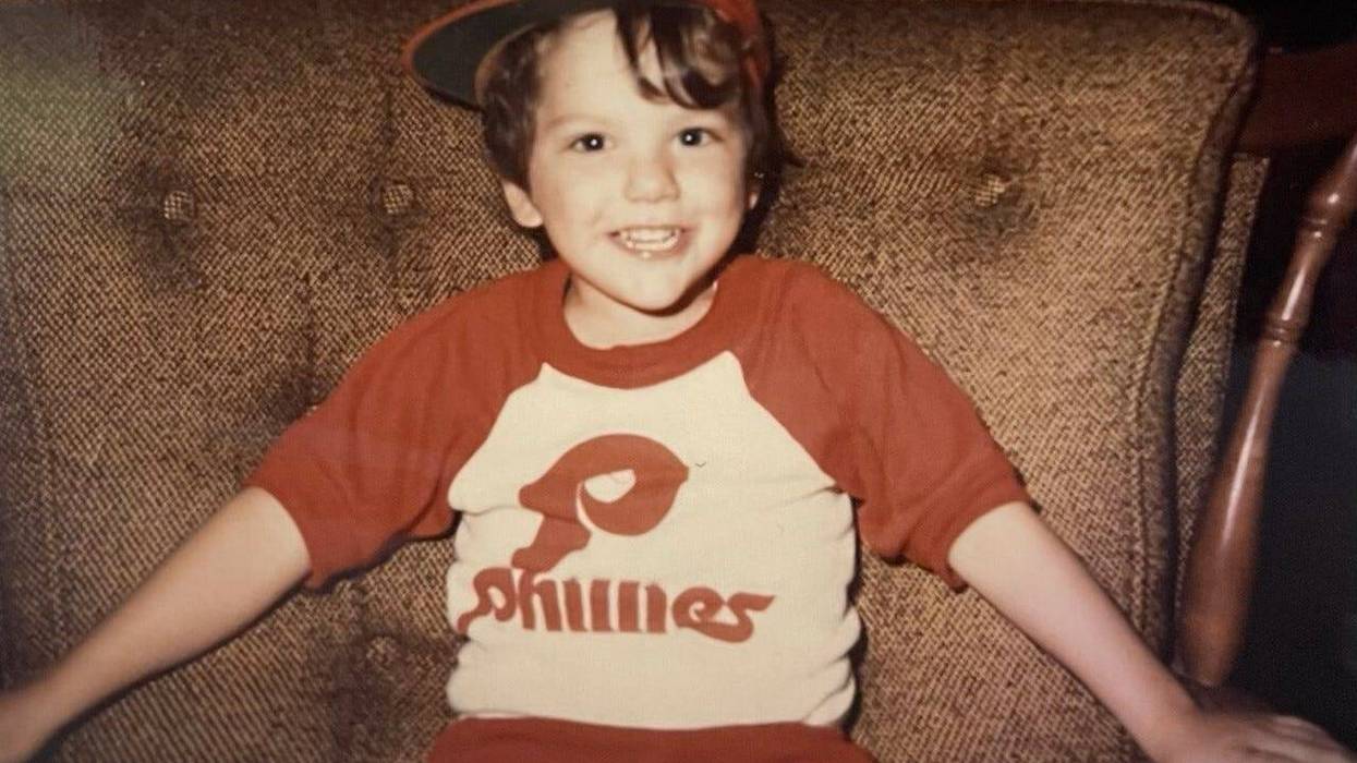Young boy in Phillies hat and shirt