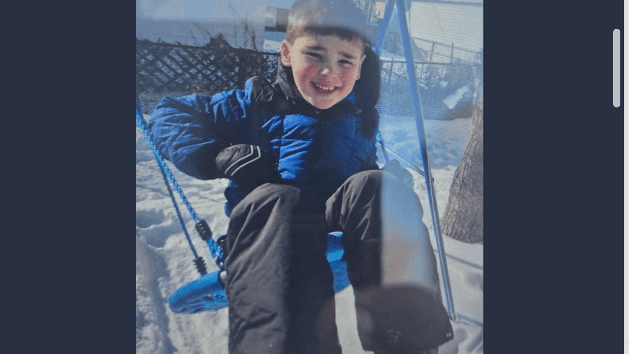 Young boy on swing