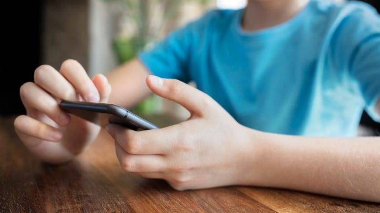 young boy on the phone