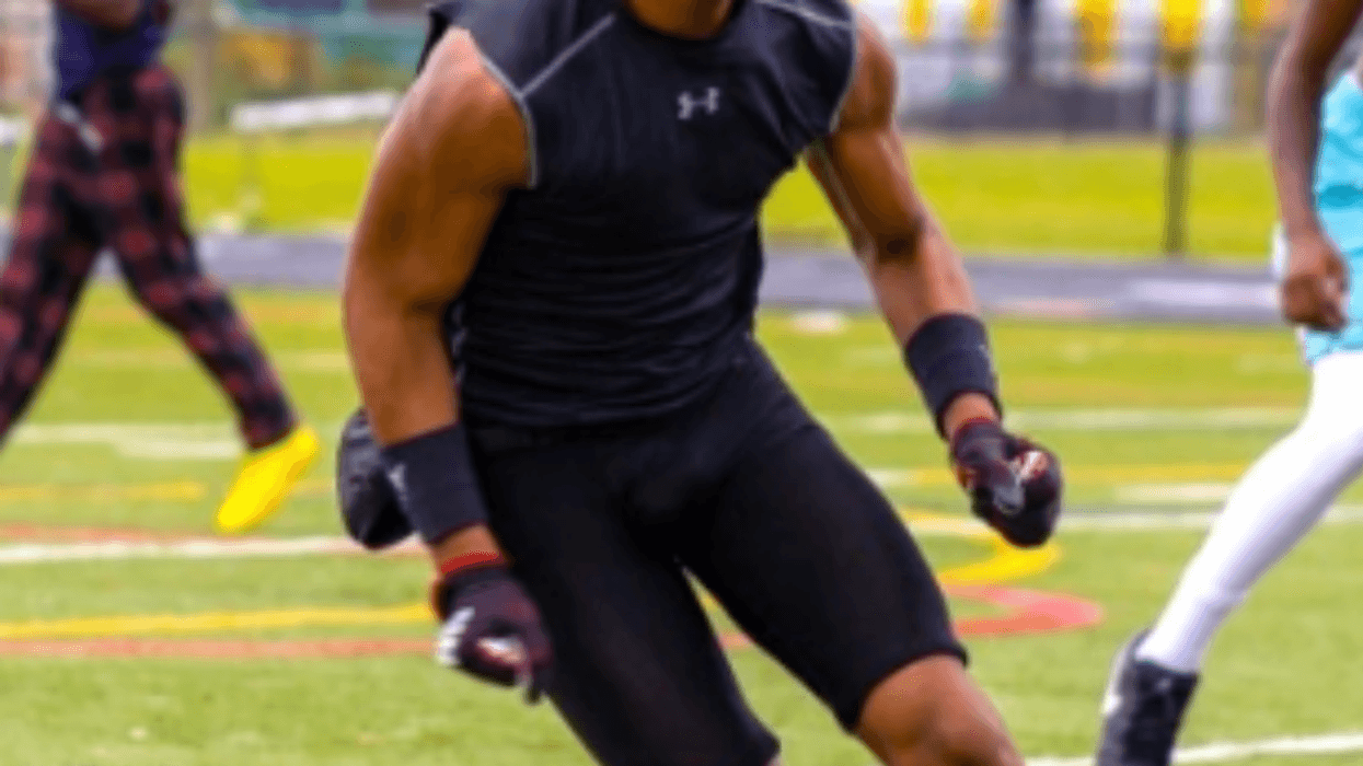 Young boy playing football