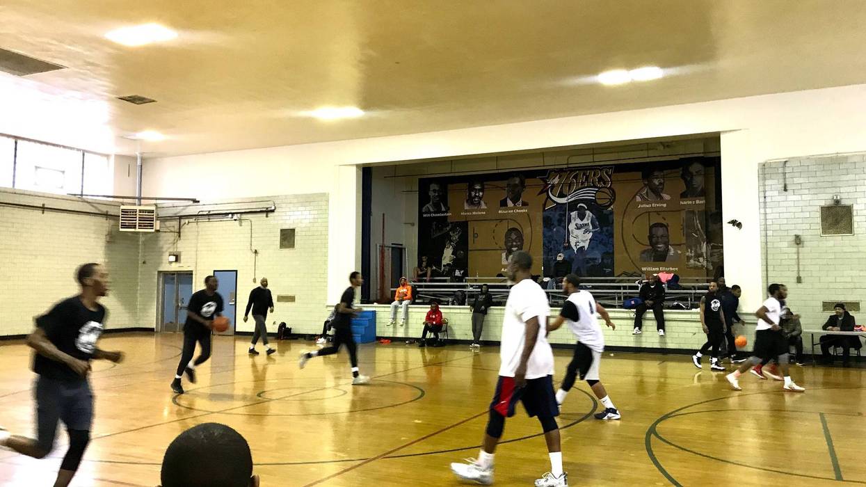 Young boys and men from all walks of life united to take part in the "Play 4 Peace" basketball game in East Germantown.