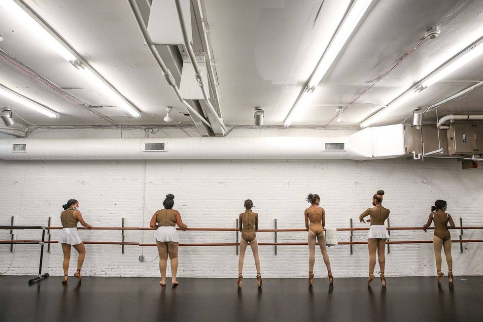 Young dancers warm up before rehearsal for their annual holiday show, "The Nutcracker: Dipped in Chocolate."