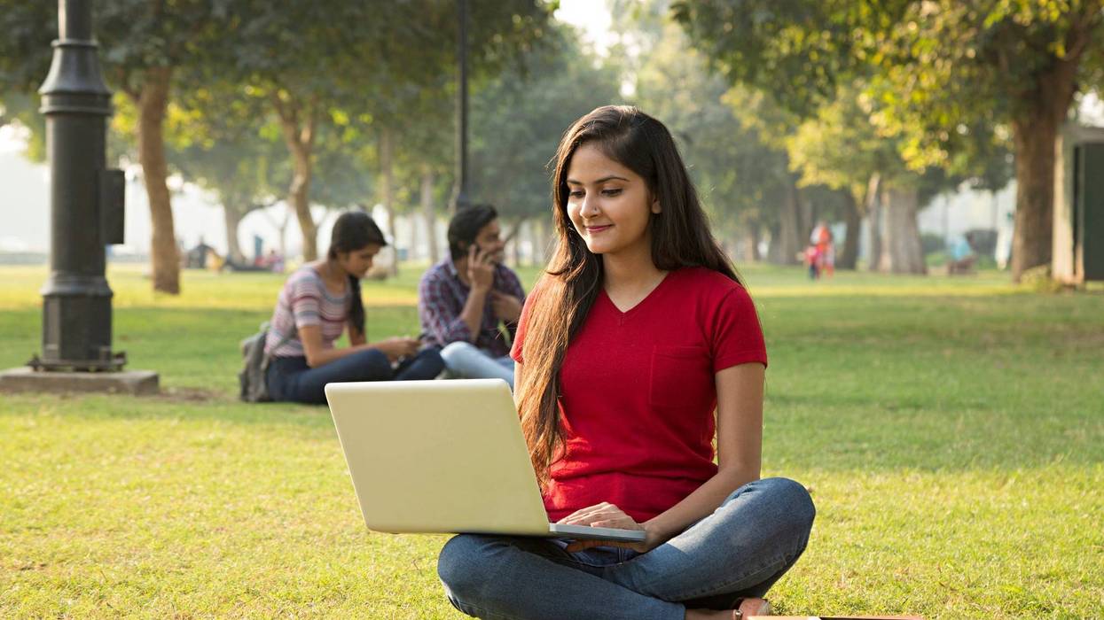 Young female student studying on campus