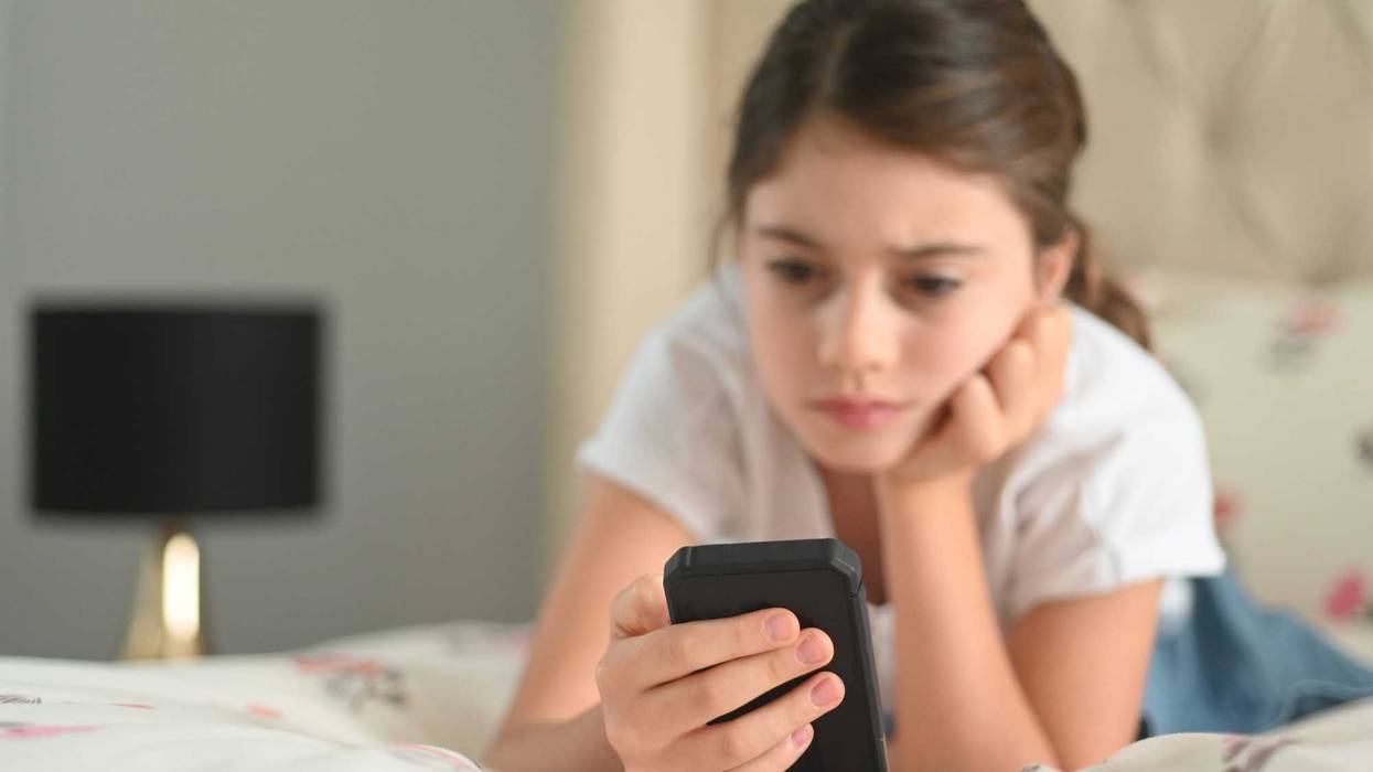 young girl using phone
