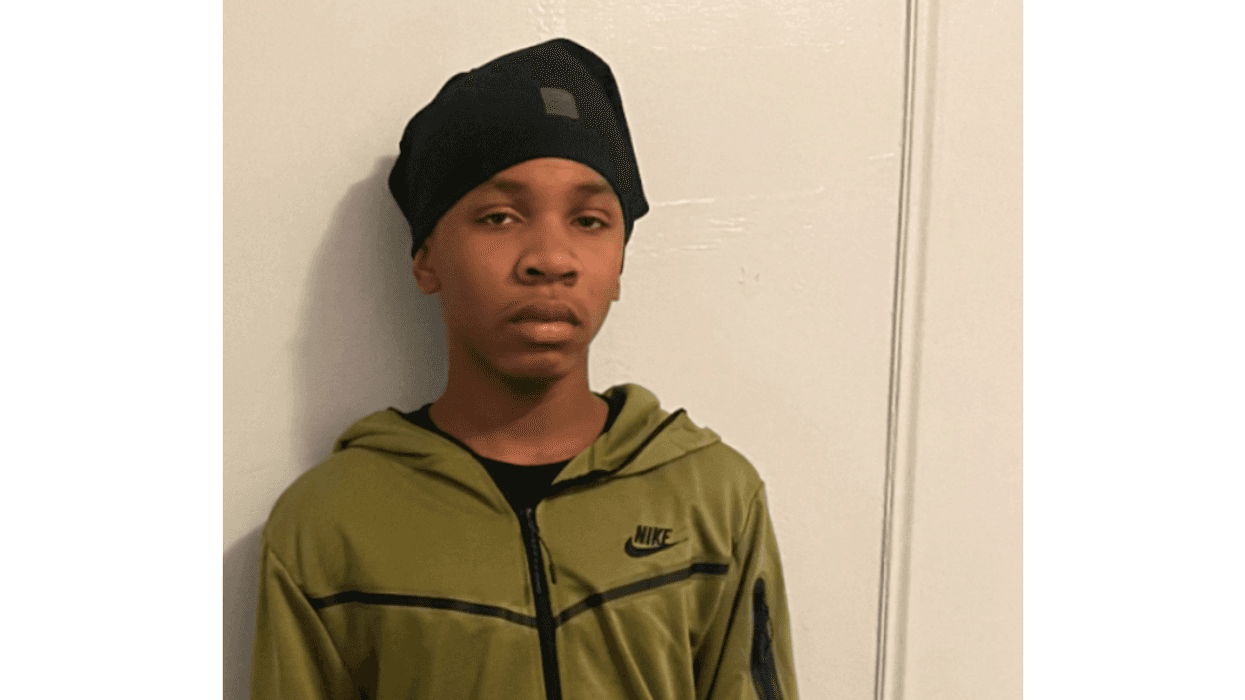 Young teen boy in Nike sweatshirt