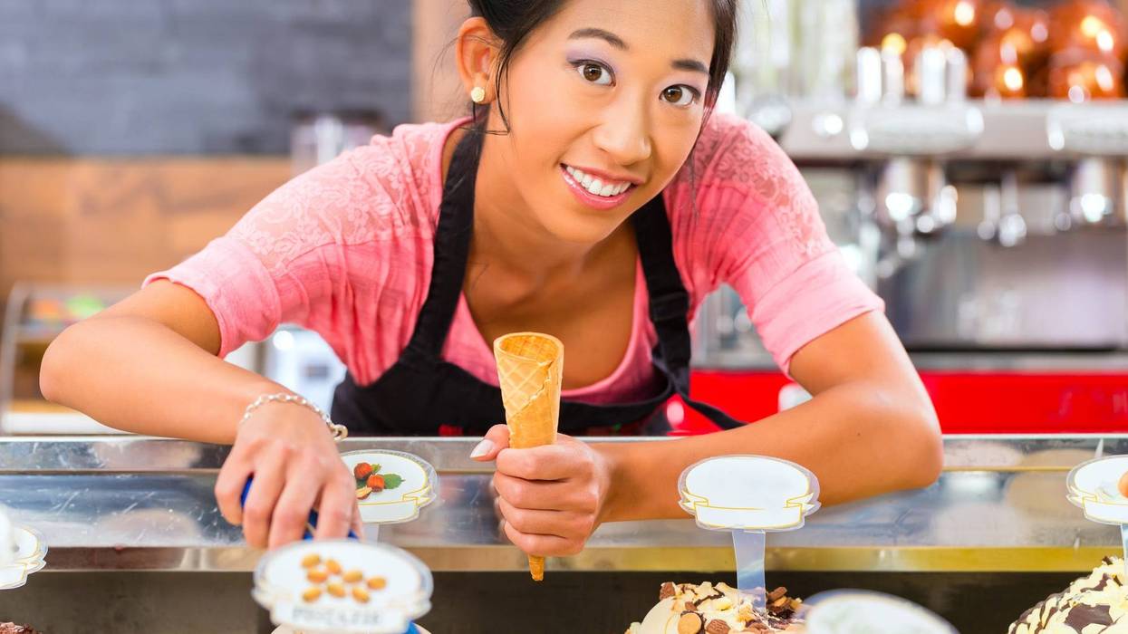 Young Woman Serving Ice Cream