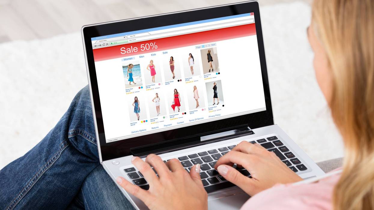 Young Woman Shopping Online On Laptop