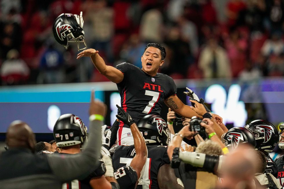 Younghoe Koo being carried off the field in celebration