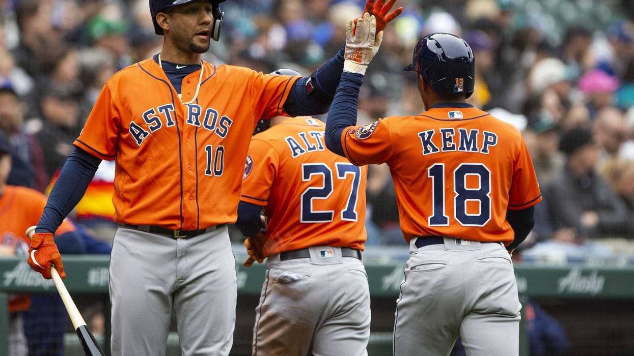 Yuli Gurriel celebrates with Tony Kemp
