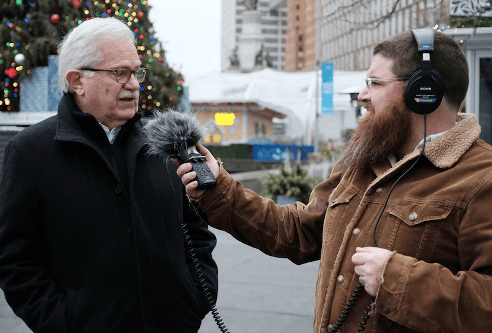 Zach Clark talks with Bob Gregory in Campus Martius Park, 2022