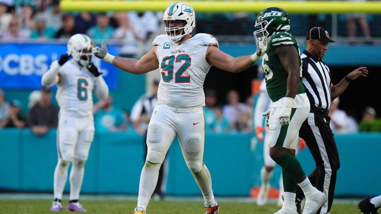 Zach Sieler celebrates after sacking New York Jets quarterback Aaron Rodgers