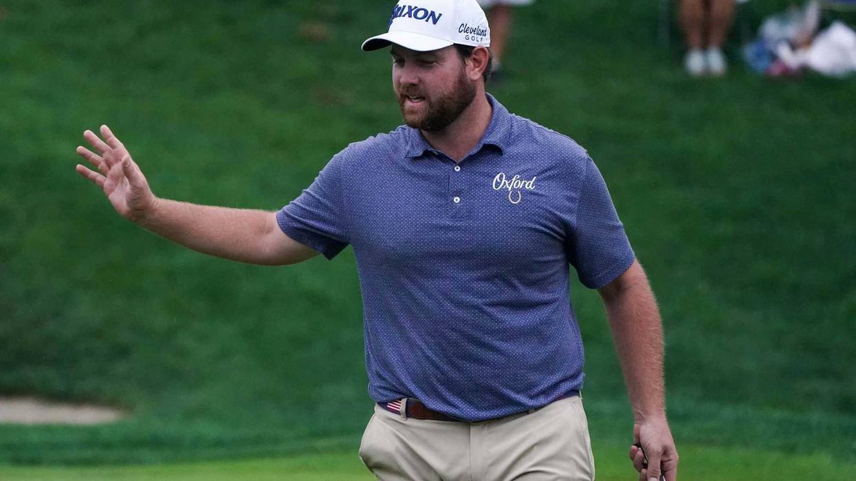 Zack Sucher reacts after his birdie on the 18th green during the first round of the Travelers Championship golf tournament at TPC River Highlands.
