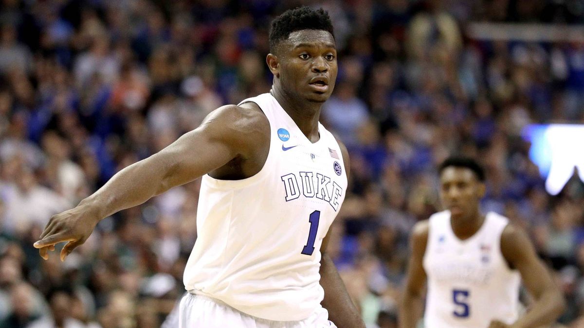 Zion Williamson points on defense during a game at Duke.