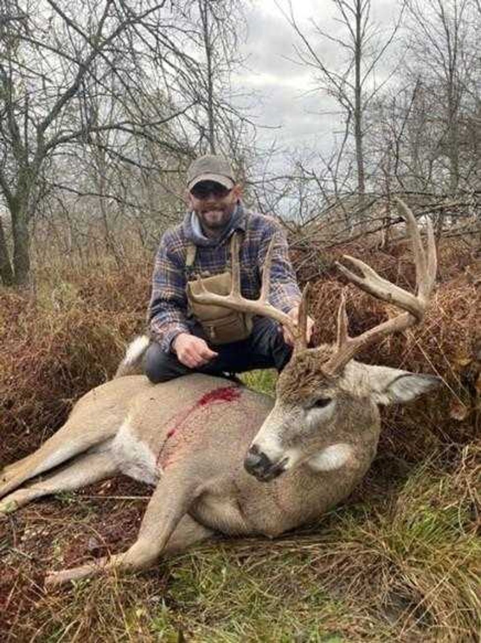 Zorda poses with deer taken illegally in Erie County.